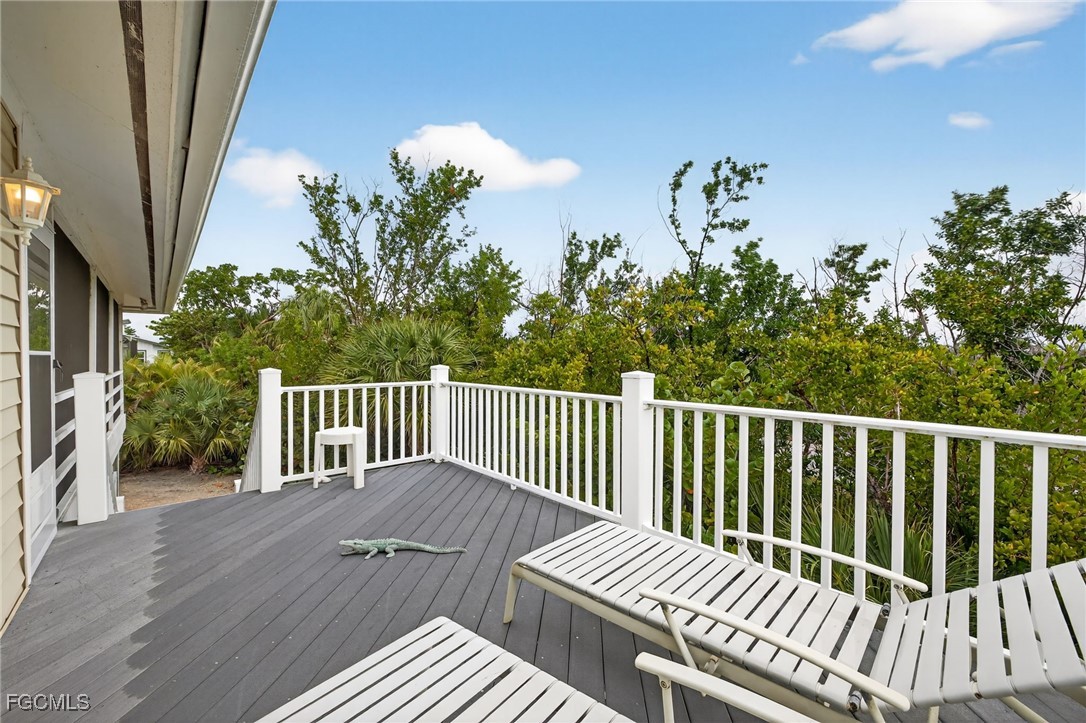 966 Sand Castle Road Sanibel, FL 33957 - Photo 24 of 39 a view of a balcony with wooden floor