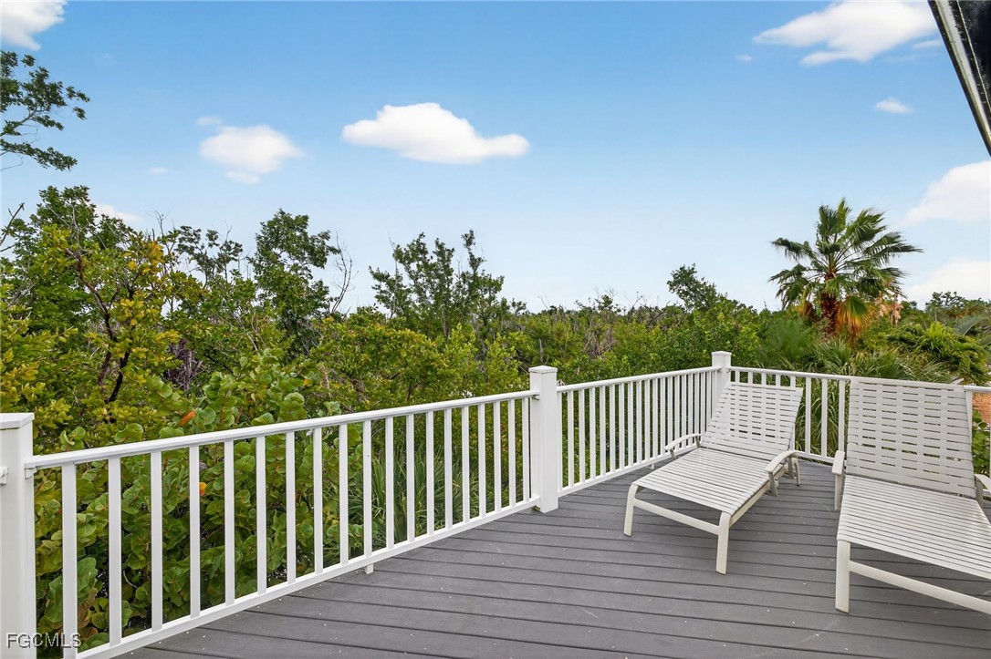 966 Sand Castle Road Sanibel, FL 33957 - Photo 25 of 39 a view of a balcony with wooden floor