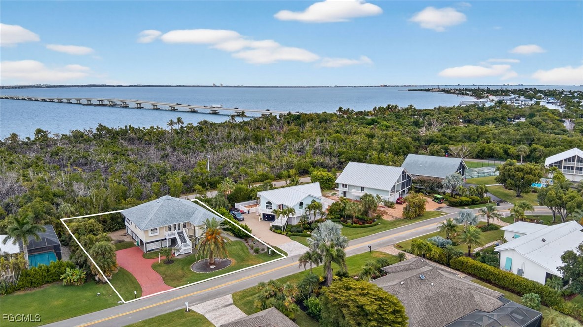 966 Sand Castle Road Sanibel, FL 33957 - Photo 33 of 39 an aerial view of a house with garden space and ocean view