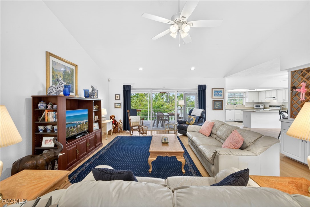966 Sand Castle Road Sanibel, FL 33957 - Photo 8 of 39 a living room with furniture and a flat screen tv
