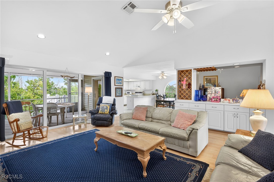 966 Sand Castle Road Sanibel, FL 33957 - Photo 9 of 39 a living room with furniture and a large window