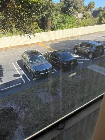 a view of a floor to ceiling window and an ocean