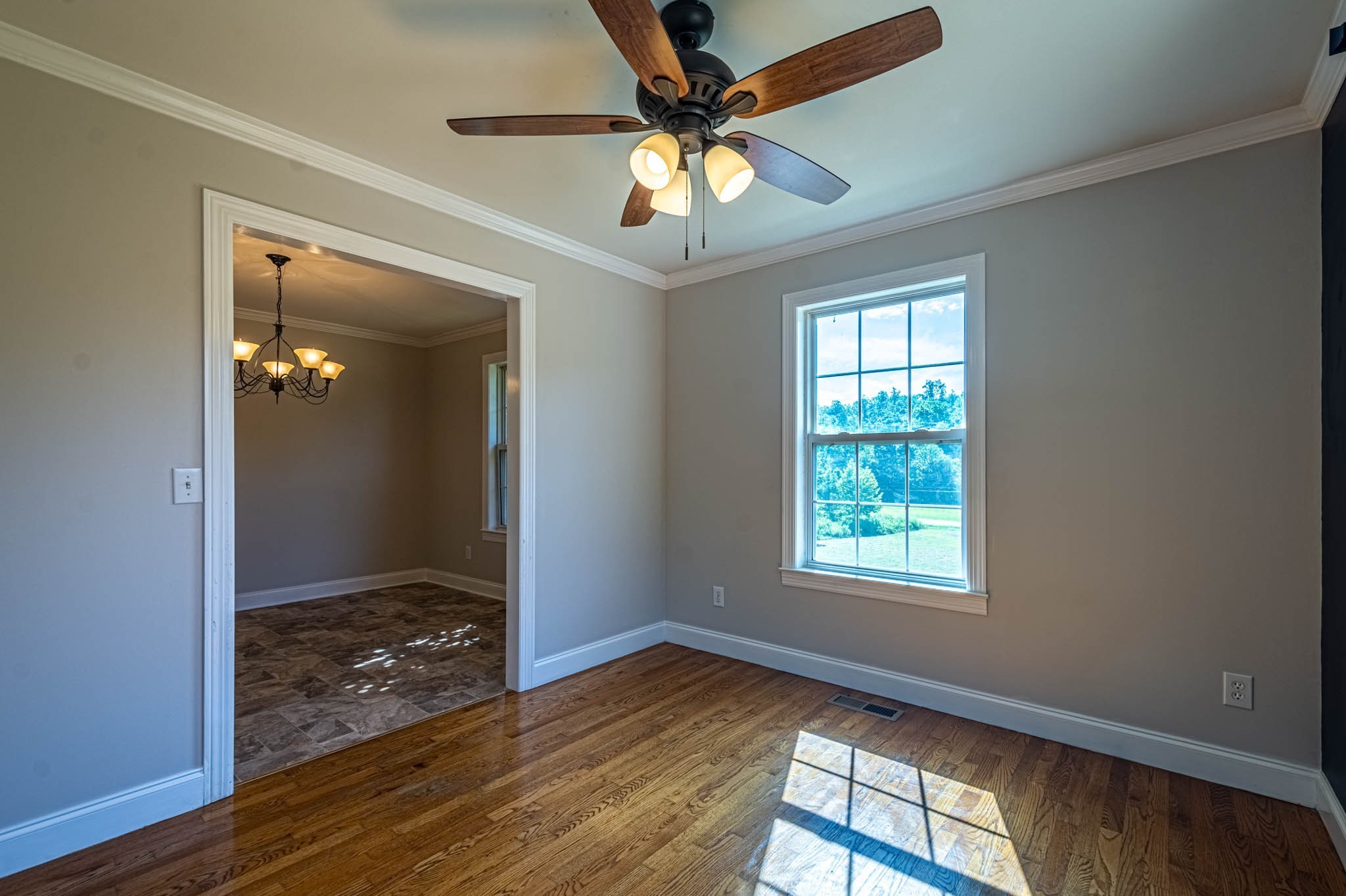 1316 Powdermill Hill Road Lawrenceburg, TN 38464 - Photo 12 of 70 wooden floor in an empty room with a window