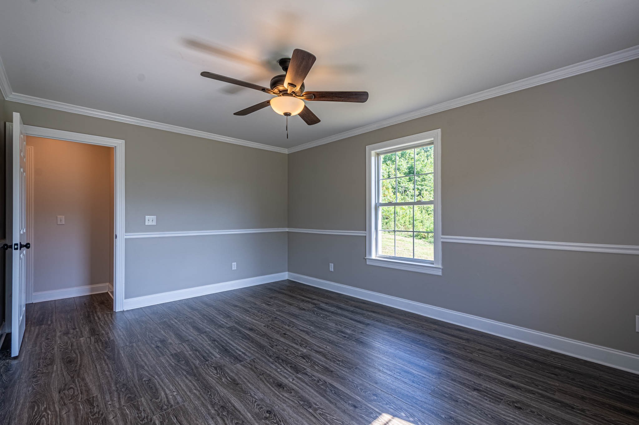 1316 Powdermill Hill Road Lawrenceburg, TN 38464 - Photo 46 of 70 a view of empty room with wooden floor and fan