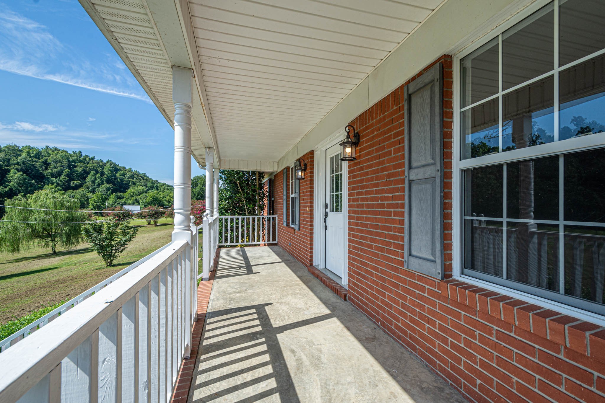 1316 Powdermill Hill Road Lawrenceburg, TN 38464 - Photo 48 of 70 a view of a balcony with wooden floor and fence