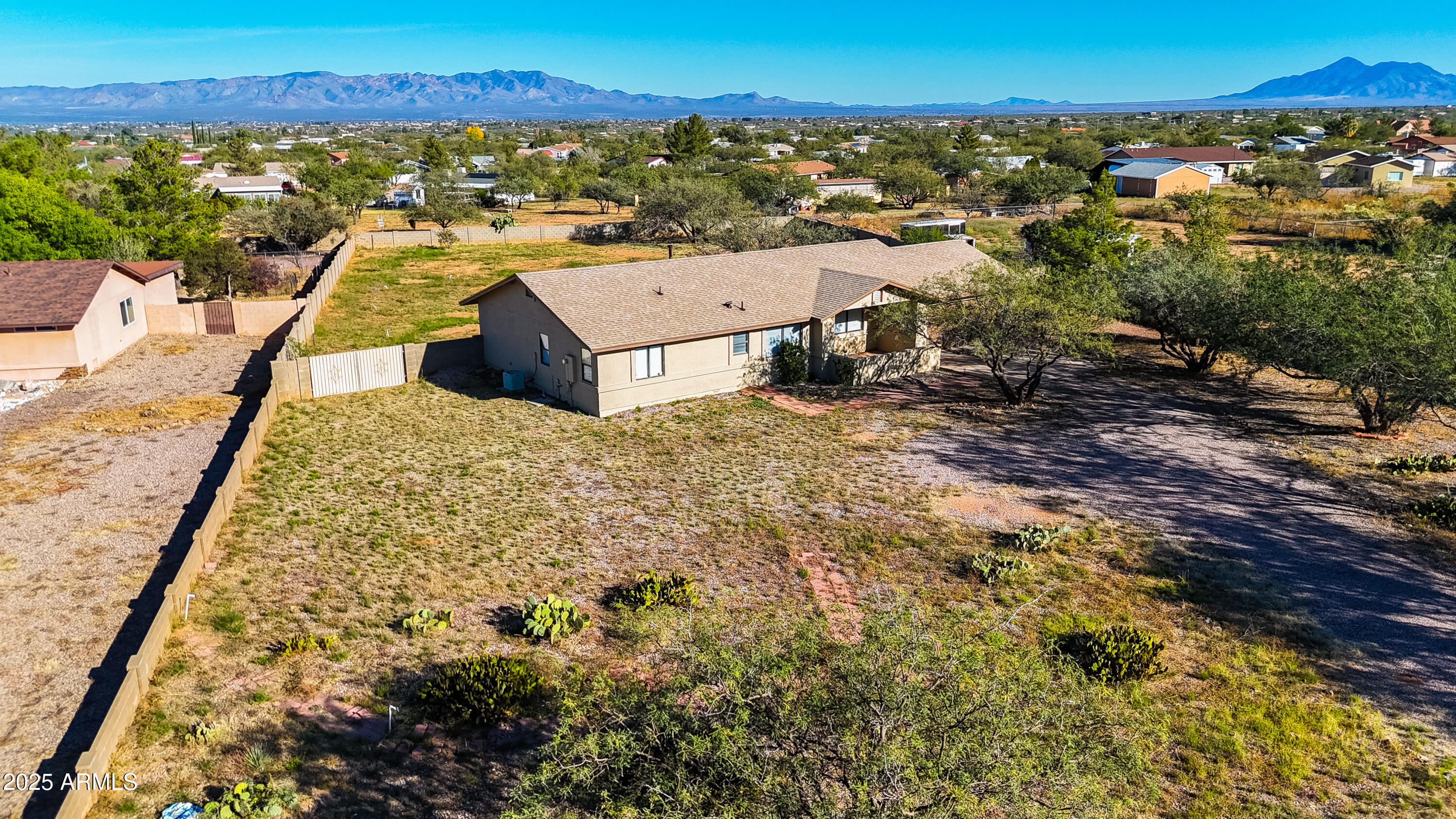 5837 South Wild Rose Road Hereford, AZ 85615 - Photo 1 of 46 an aerial view of residential houses with outdoor space