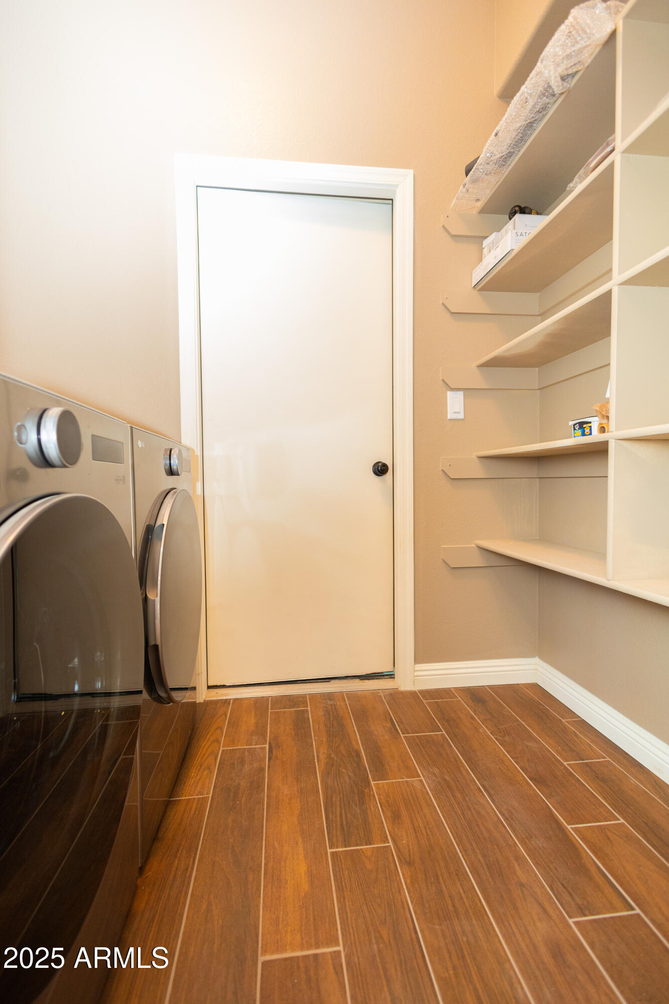 5837 South Wild Rose Road Hereford, AZ 85615 - Photo 15 of 46 a view of a room with shelves on the wall