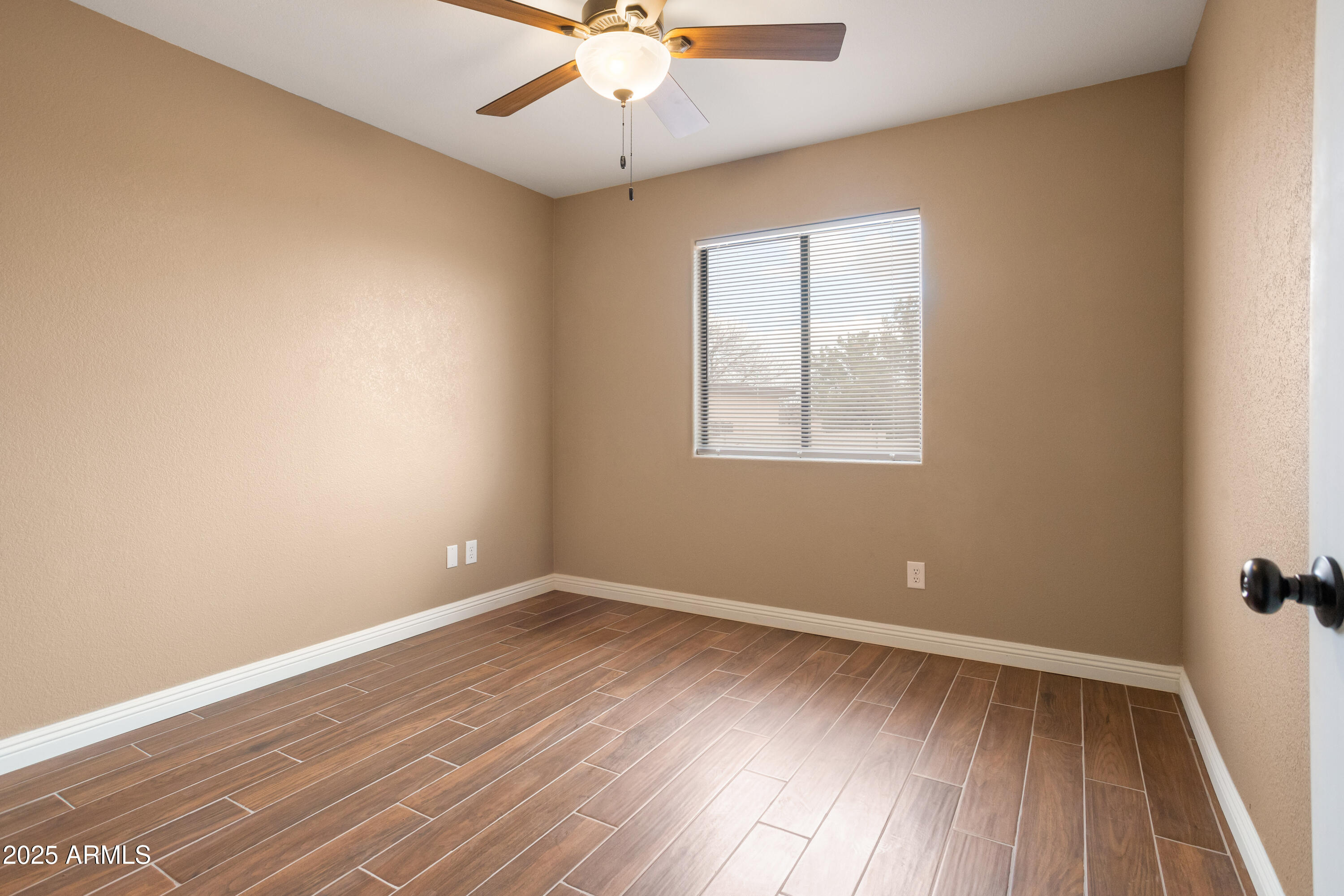 5837 South Wild Rose Road Hereford, AZ 85615 - Photo 24 of 46 wooden floor in an empty room with a window