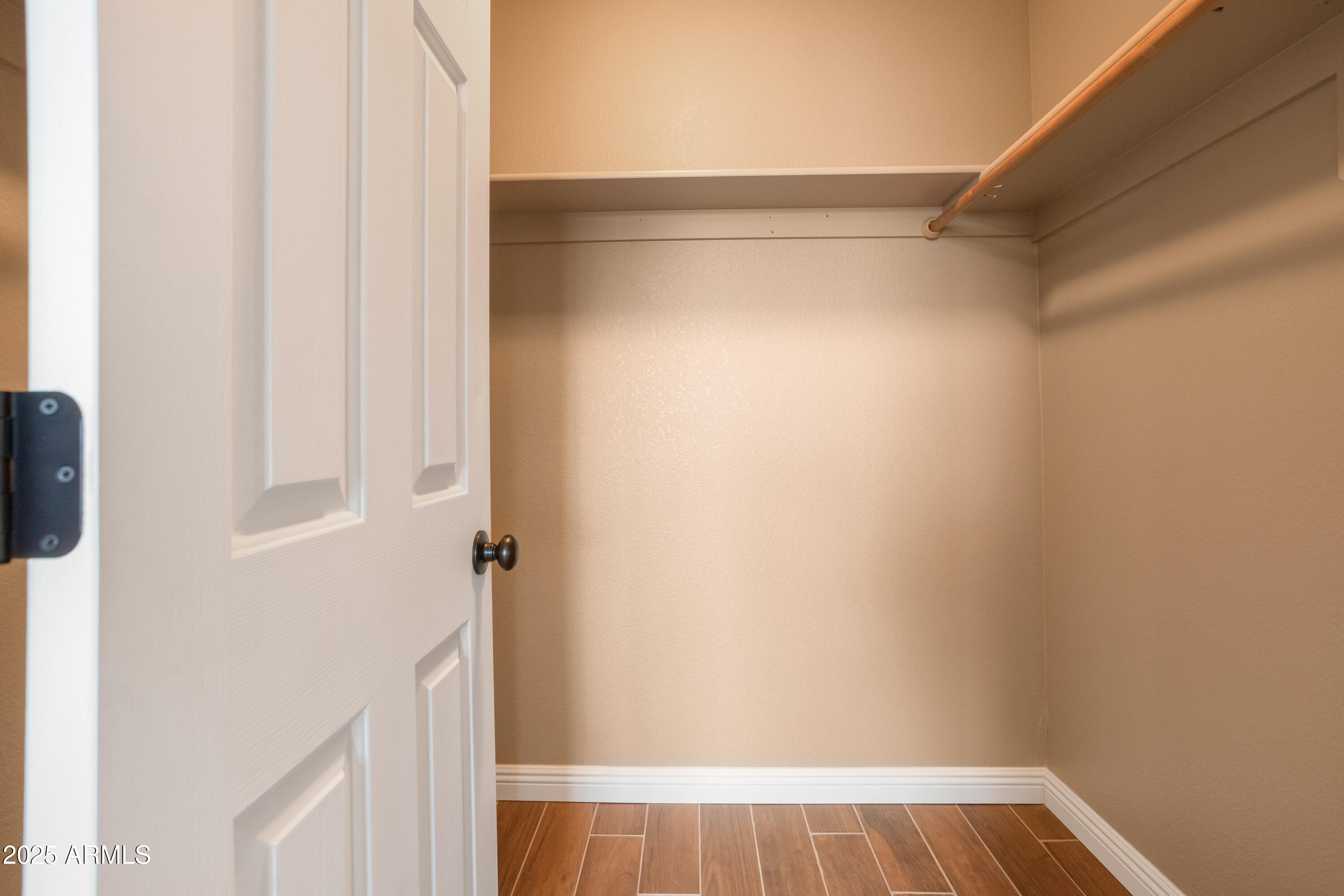 5837 South Wild Rose Road Hereford, AZ 85615 - Photo 26 of 46 a view of walk in closet with clothes
