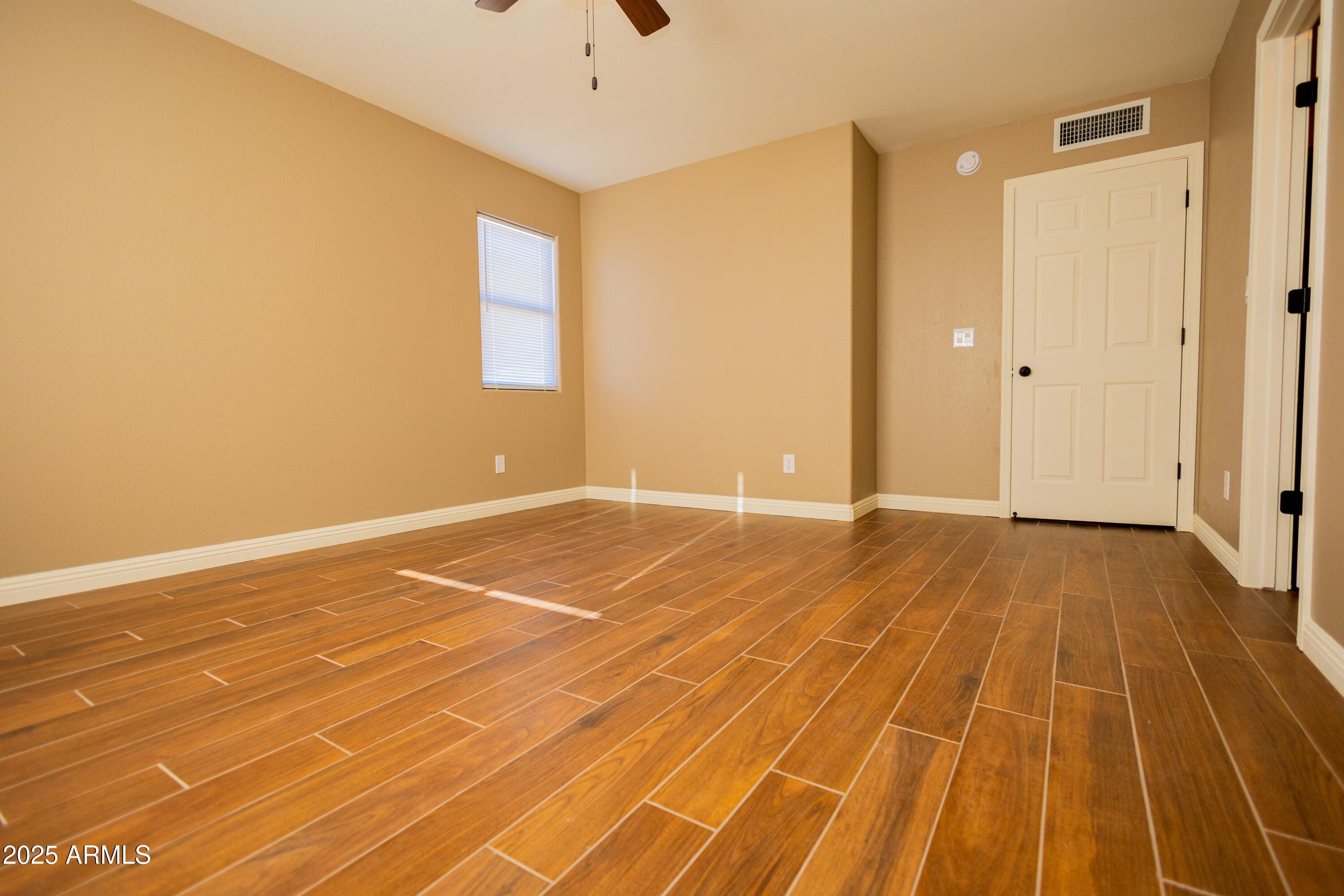 5837 South Wild Rose Road Hereford, AZ 85615 - Photo 29 of 46 a view of an empty room with wooden floor