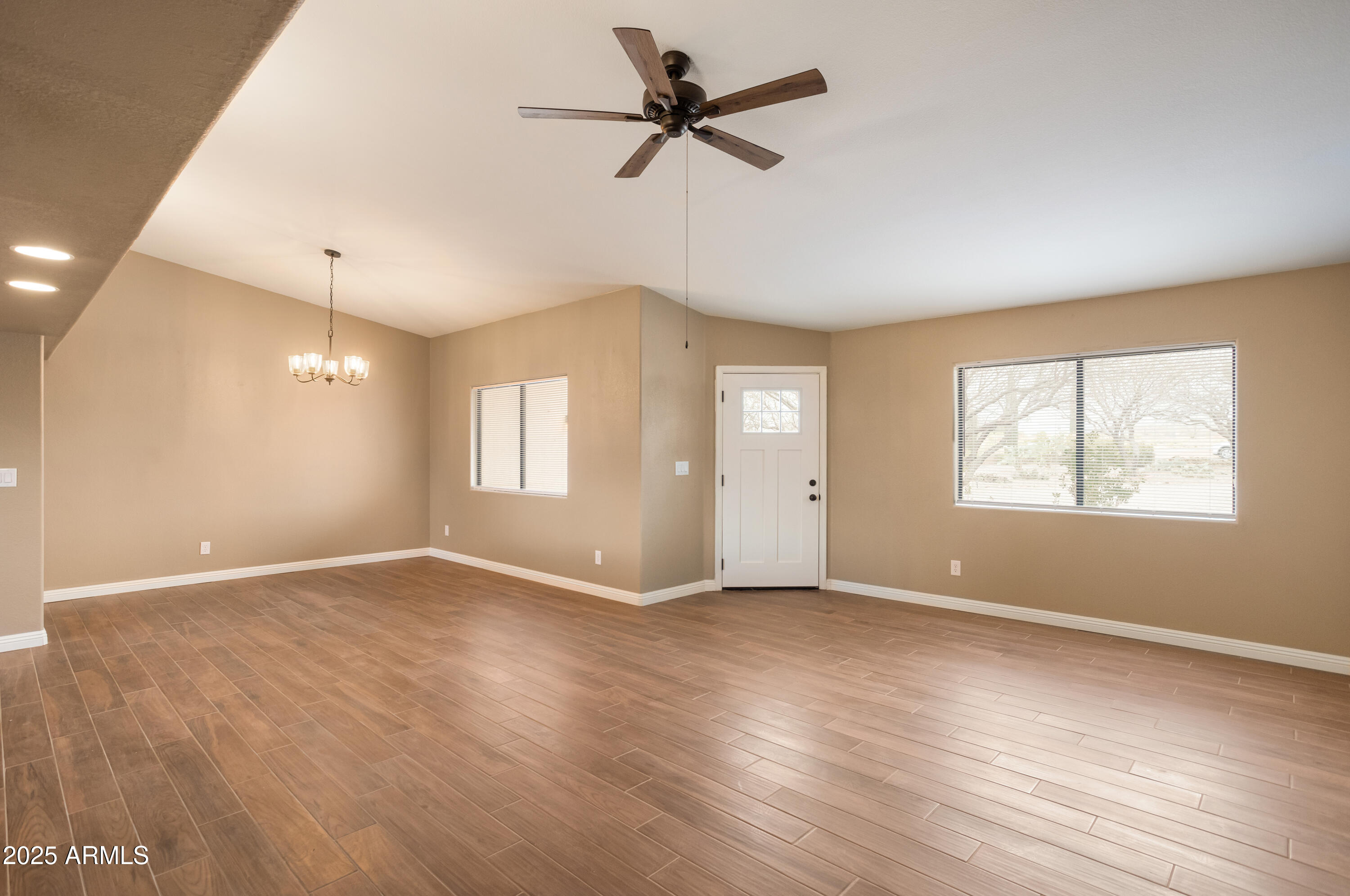 5837 South Wild Rose Road Hereford, AZ 85615 - Photo 4 of 46 wooden floor in an empty room with a window