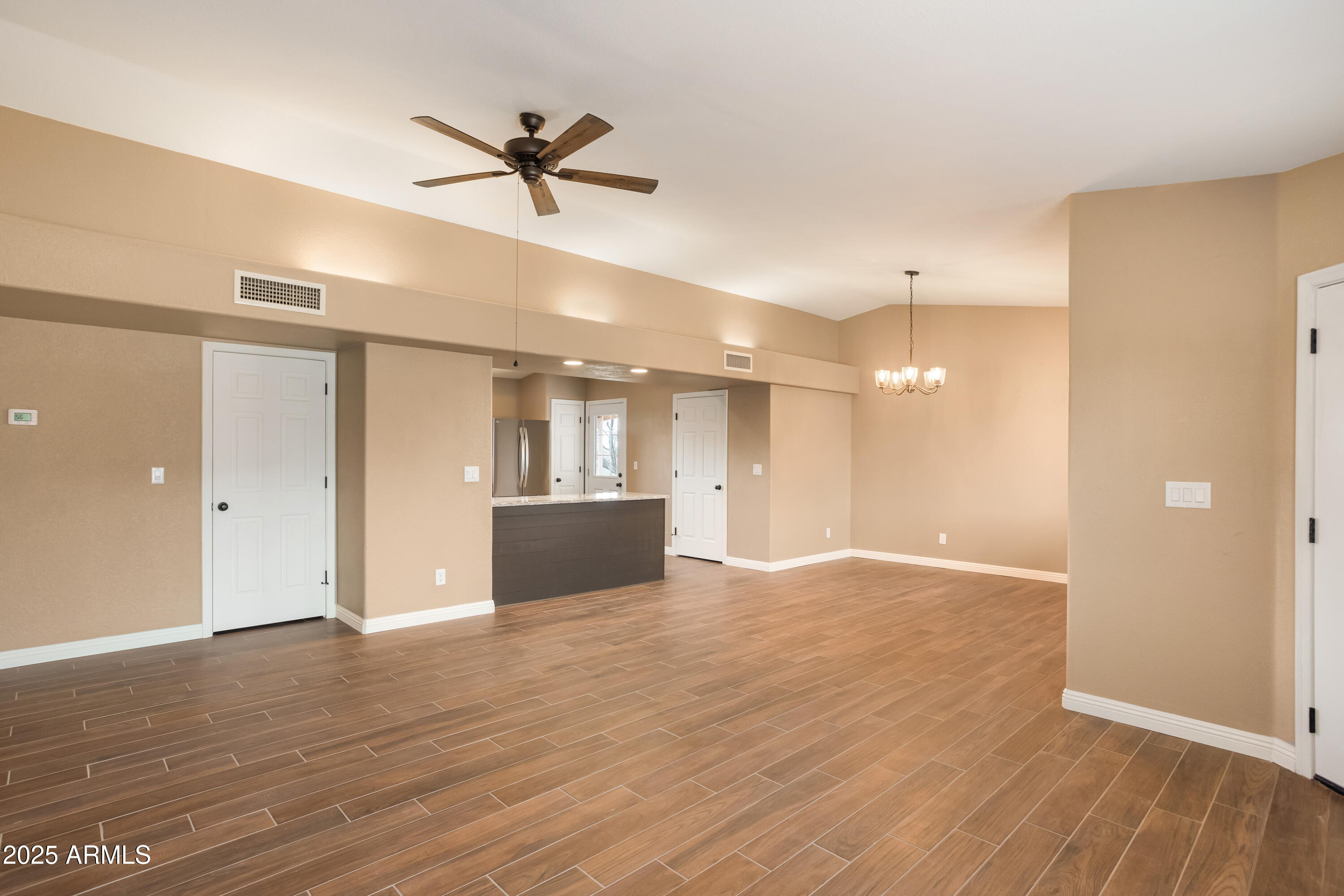 5837 South Wild Rose Road Hereford, AZ 85615 - Photo 5 of 46 a view of an empty room and wooden floor