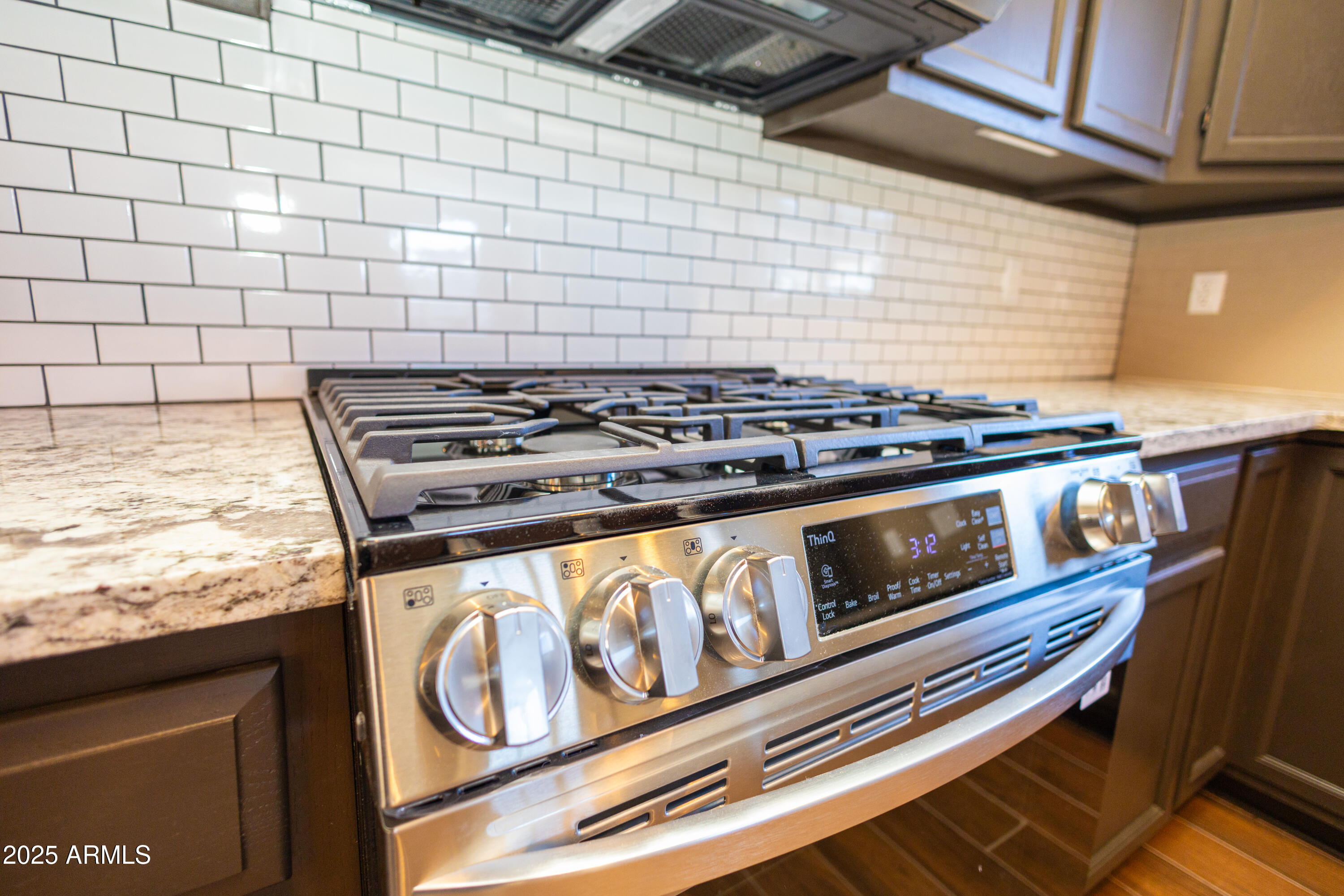 5837 South Wild Rose Road Hereford, AZ 85615 - Photo 9 of 46 a stove top oven sitting inside of a kitchen