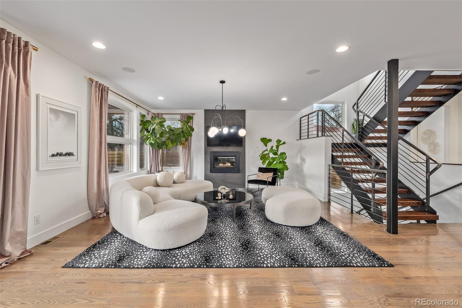 a living room with furniture potted plant and a window