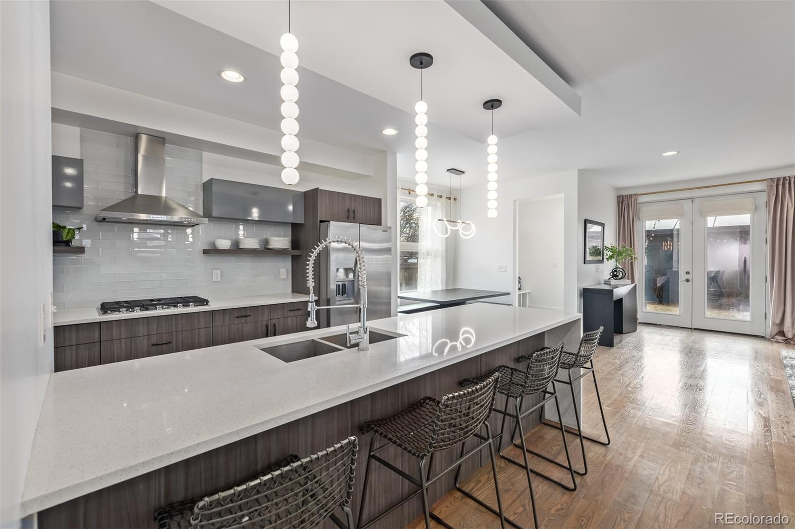 2245 Meade Street Denver, CO 80211 - Photo 12 of 40 a kitchen with counter top space cabinets and stainless steel appliances