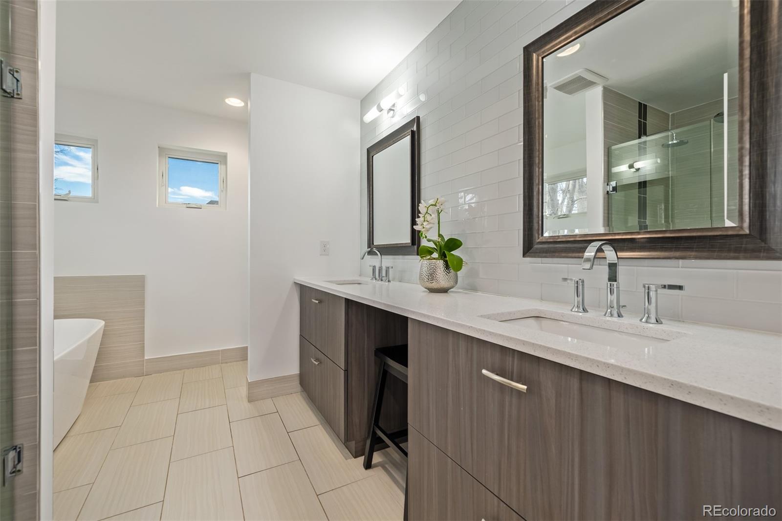 2245 Meade Street Denver, CO 80211 - Photo 18 of 40 a bathroom with a double vanity sink and a mirror