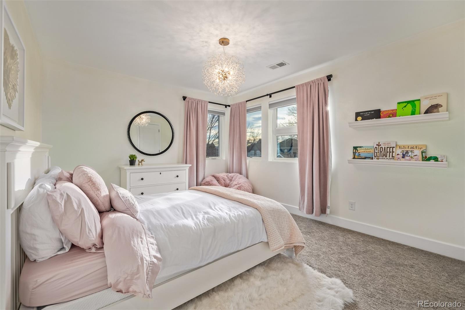 2245 Meade Street Denver, CO 80211 - Photo 22 of 40 a bedroom with a bed large window with outer view and mirror