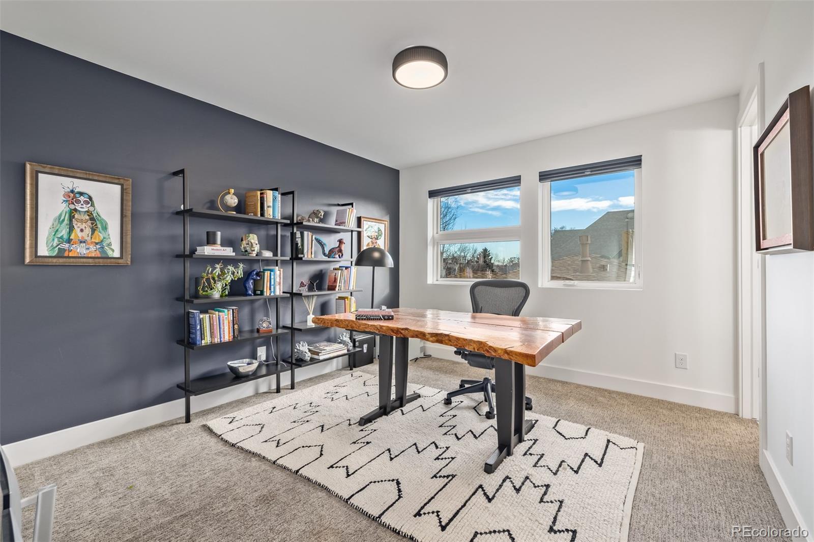 2245 Meade Street Denver, CO 80211 - Photo 25 of 40 a work room with furniture and a bookshelf