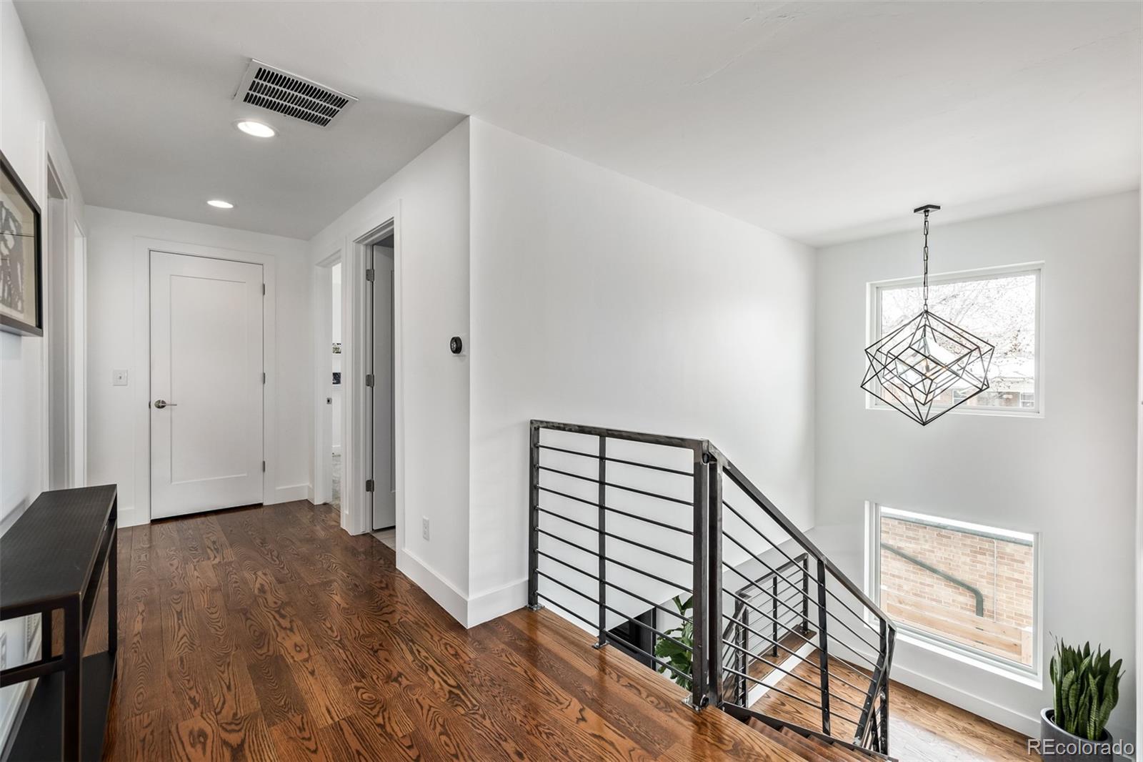 2245 Meade Street Denver, CO 80211 - Photo 29 of 40 a view of a hallway with workspace