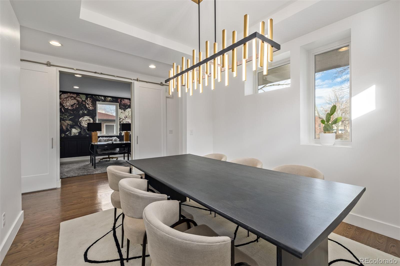 2245 Meade Street Denver, CO 80211 - Photo 3 of 40 a view of a livingroom with furniture and wooden floor
