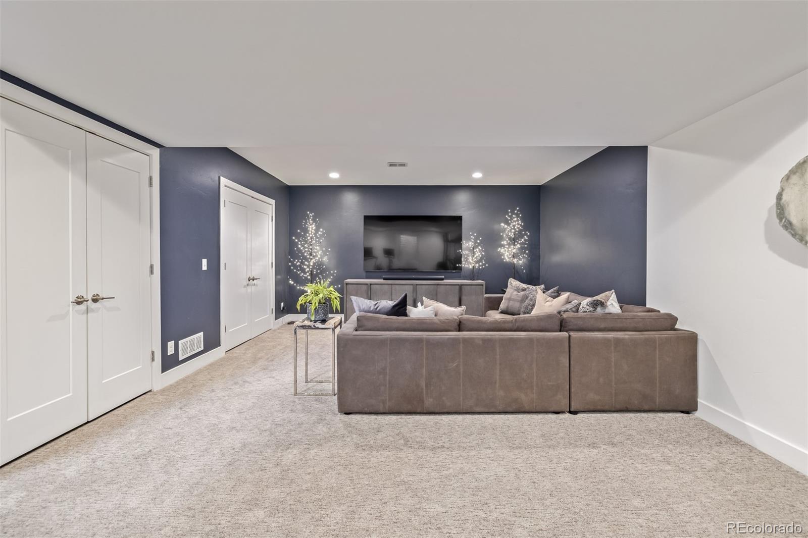 2245 Meade Street Denver, CO 80211 - Photo 31 of 40 a living room with furniture and a flat screen tv