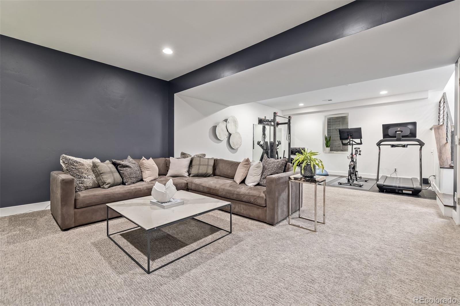 2245 Meade Street Denver, CO 80211 - Photo 32 of 40 a living room with furniture and wooden floor
