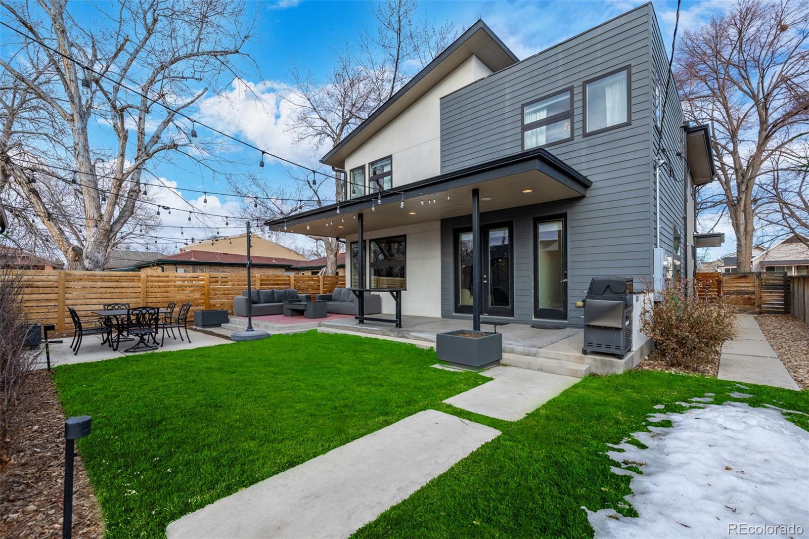 2245 Meade Street Denver, CO 80211 - Photo 36 of 40 a view of a house with a yard porch and sitting area