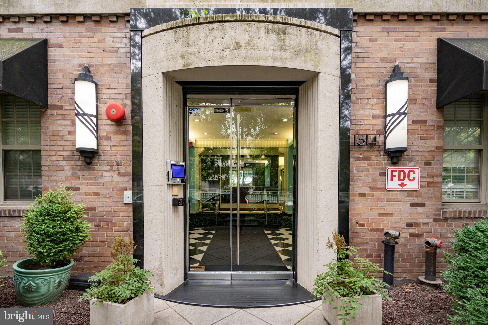 1314 Massachusetts Avenue Northwest, Unit 608 Washington, DC 20005 - Photo 2 of 40 a front view of a house with a entrance
