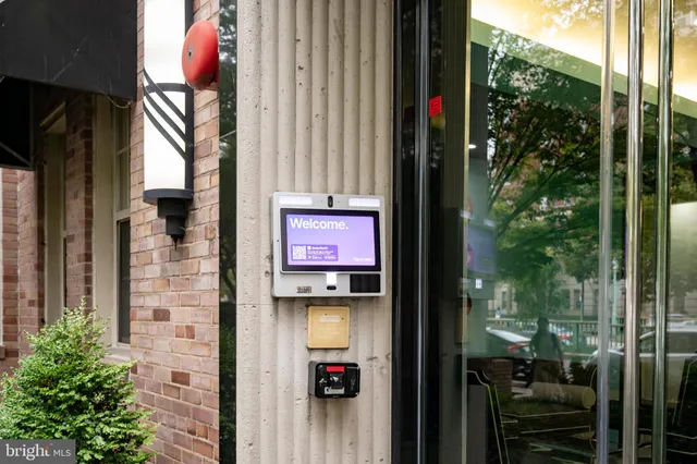 a glass door with a red gate