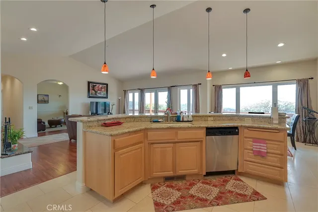 a living room with furniture a fireplace and a table