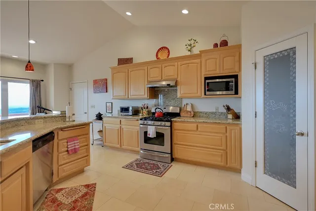 a spacious bathroom with a granite countertop tub sink and mirror