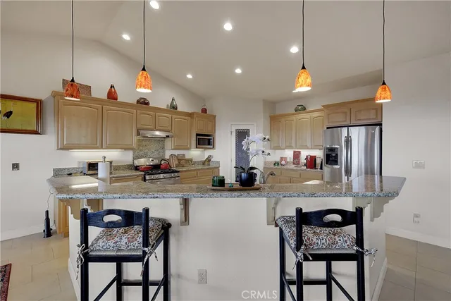 a bathroom with a tub a sink and a window