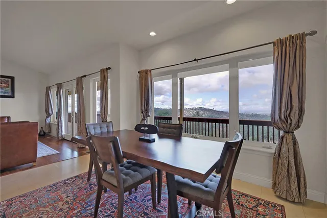 a bathroom with a tub a sink and a window