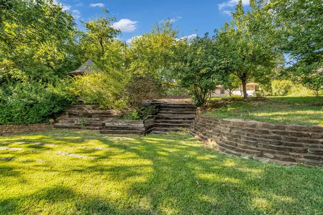 a view of a garden with an outdoor space
