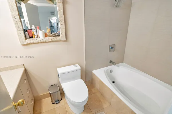 a bathroom with a toilet and sink