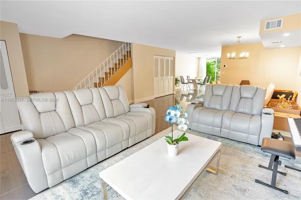 a living room with furniture and a couch
