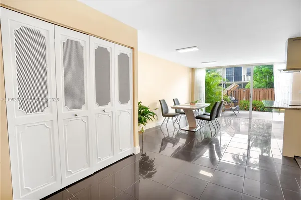a view of a living room with a floor to ceiling window and floor to ceiling window