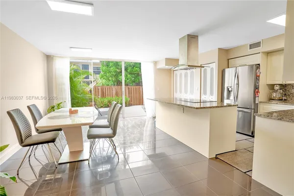 a view of a dining room with furniture window and outside view