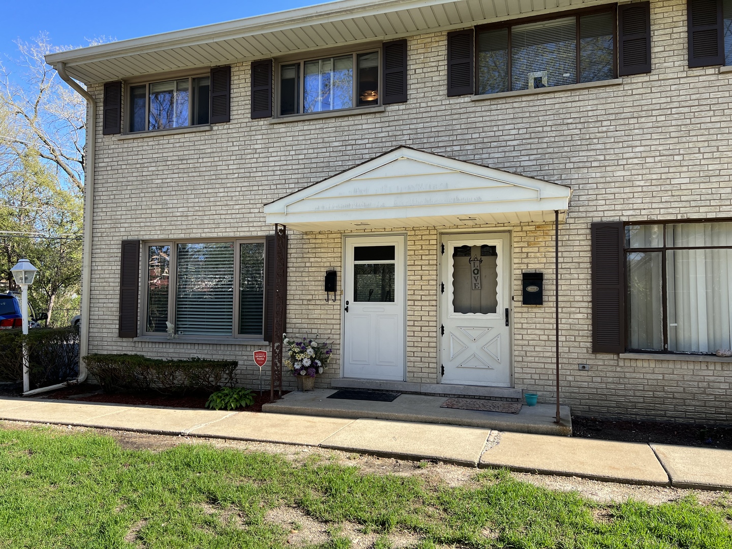 602 West Central Road Arlington Heights, IL 60005 - Photo 2 of 22 a front view of a house with garden