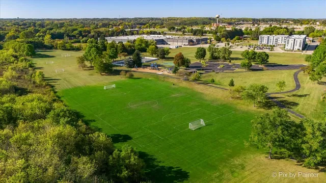 an aerial view of residential houses with outdoor space