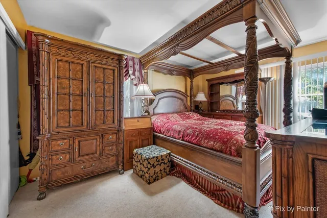 a bedroom with a bed a closet and large mirror