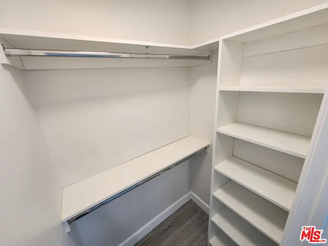 a view of an empty walk in closet