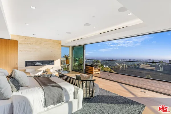 a lobby with a couch and a floor to ceiling window