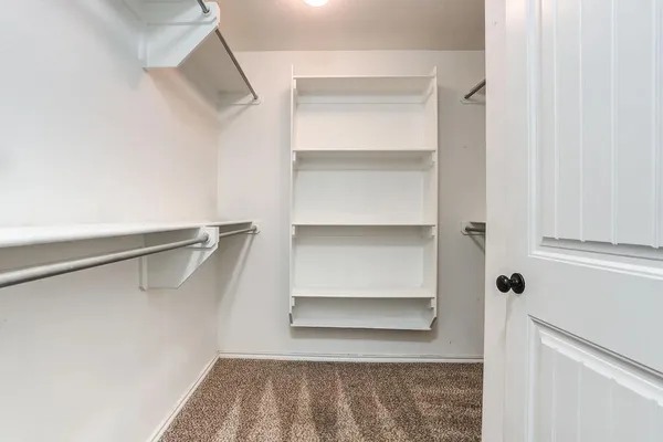 a view of kitchen with stainless steel appliances granite countertop a stove a sink a refrigerator and a microwave