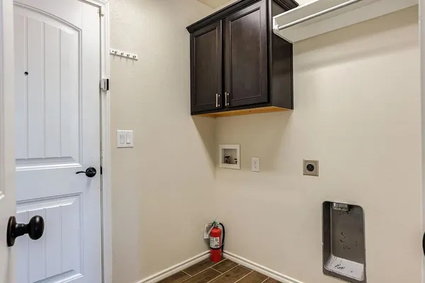 a bathroom with a granite countertop sink toilet a mirror and bathtub