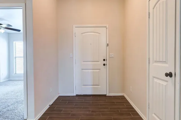 a view of an empty room with a window