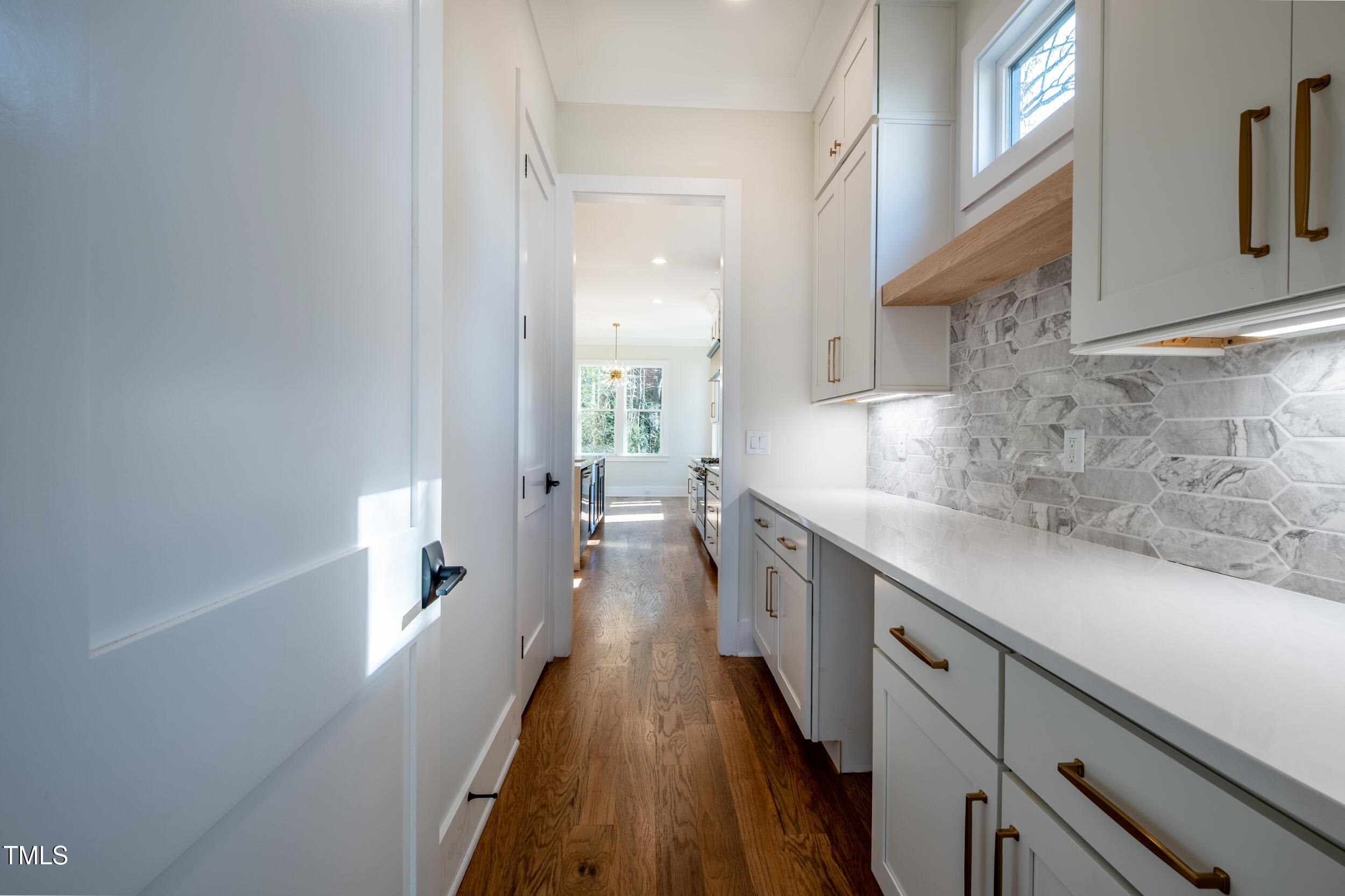 3000 Eden Harbor Court Raleigh, NC 27613 - Photo 5 of 27 a kitchen with sink and cabinets