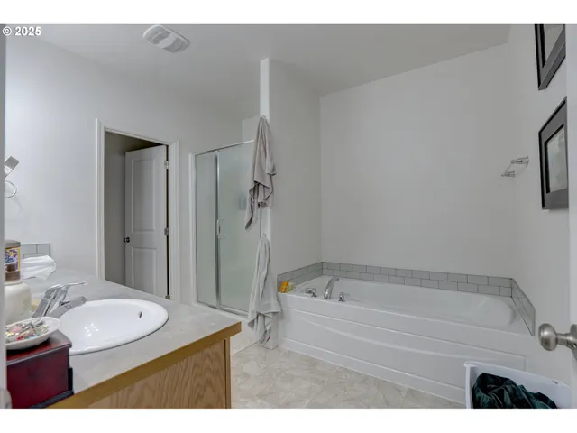 a bathroom with a sink a mirror and a bathtub