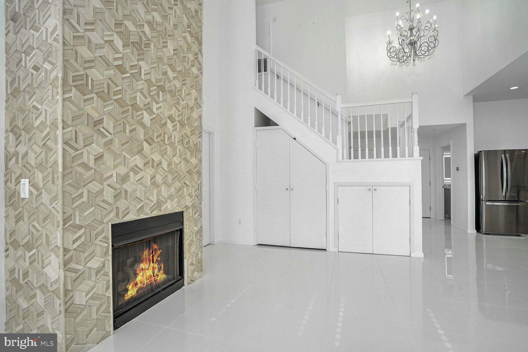 12000 Market Street, Unit 421 Reston, VA 20190 - Photo 11 of 64 Laundry and additional storage beneath stairs.