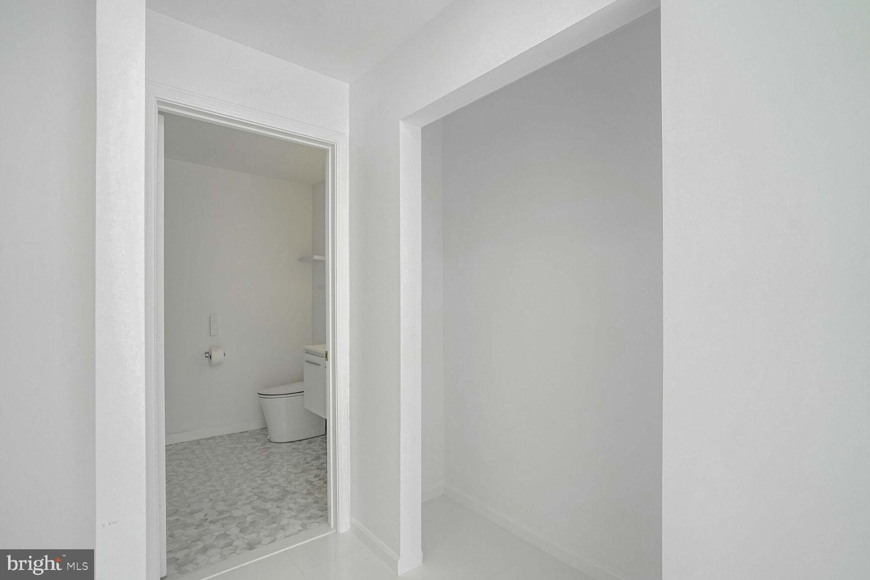 12000 Market Street, Unit 421 Reston, VA 20190 - Photo 28 of 64 Owners Closet and Bathroom